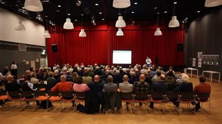 Presentatie tijdens informatiebijeenkomst