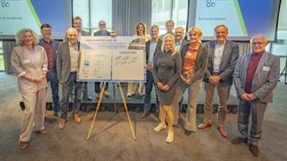 Groepsfoto Verdygo community bij ondertekend bord